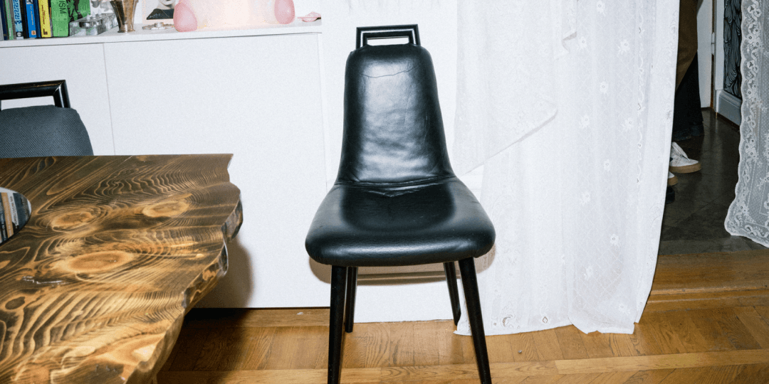 press-releases-from-stockholm-design-week_1080x540.png A black leather chair in a room with furniture and decor during Stockholm Design Week