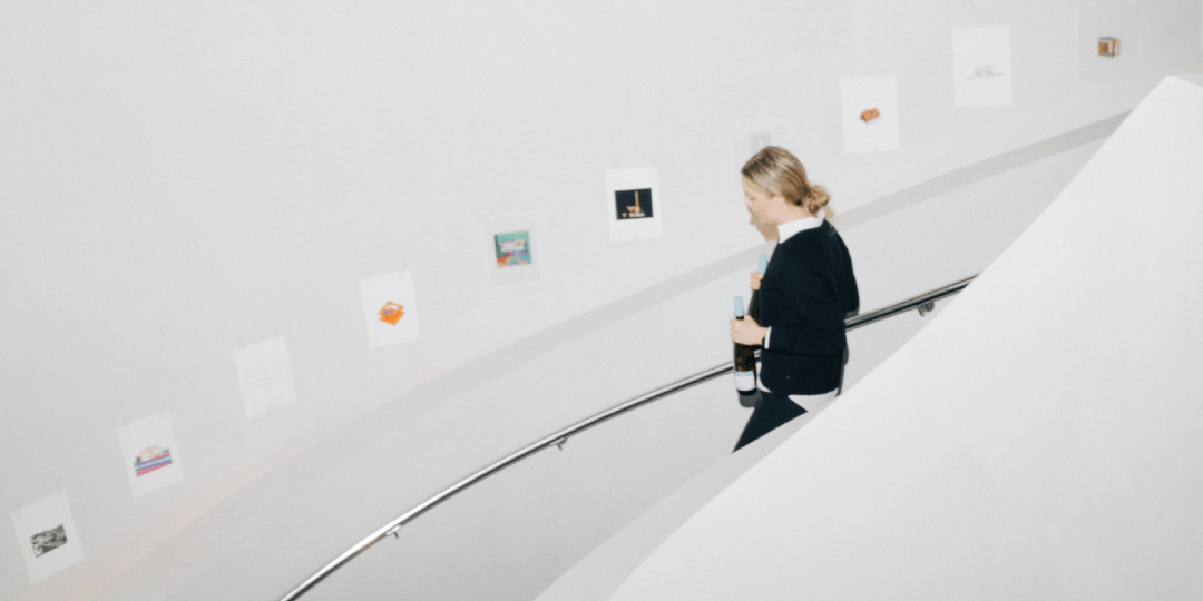 stockholm-design-weeks-image-gallery_1080x540.png A staircase with images on the wall taken during Stockholm Design Week