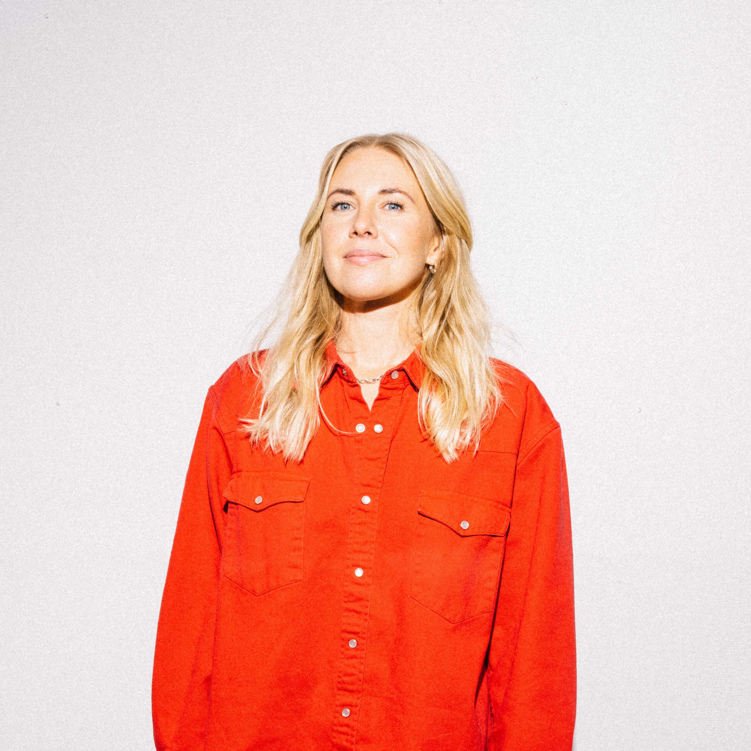 Charlotta_Press-contact Photo of woman in red shirt