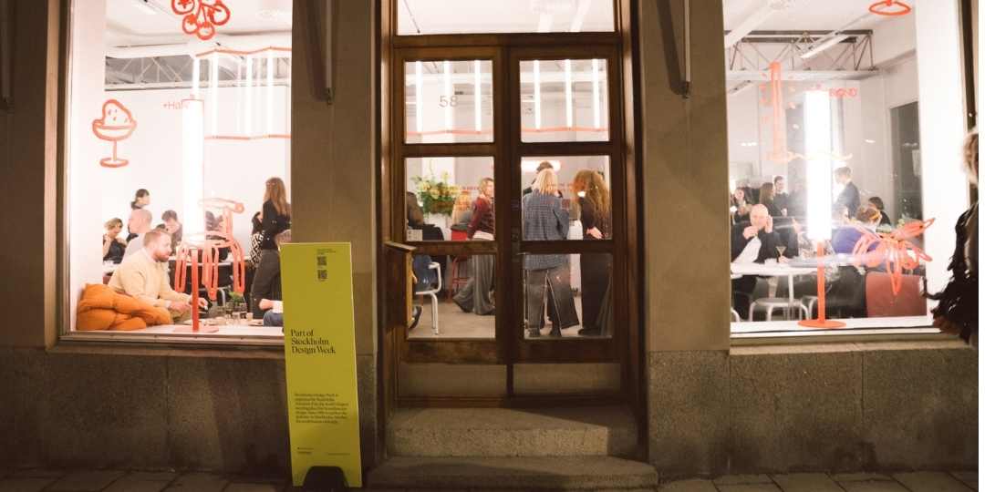 yellos Stockholm Design Week sign outside a window of a showroom during the design week in 2025.
